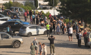 People on Greeces Island of Rhodes Gather to Observe Wildfire