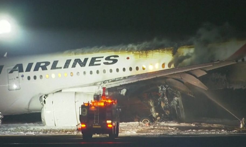 Japan Airlines Airplane in Flames on Runway of Tokyo's Haneda Airport